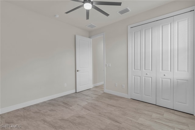 unfurnished bedroom featuring a closet and ceiling fan