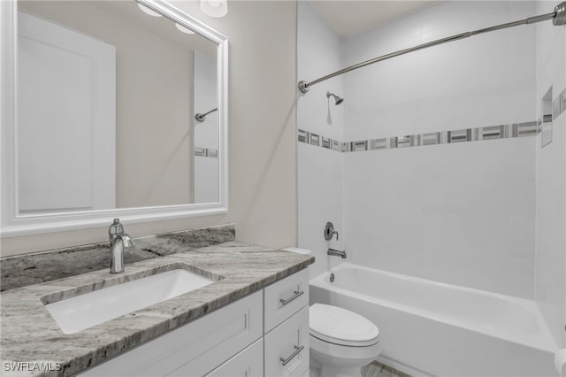 full bathroom with vanity, toilet, and tiled shower / bath combo