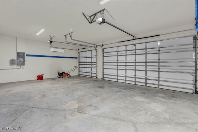 garage with a garage door opener and electric panel