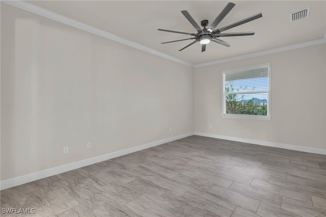 spare room with ornamental molding and ceiling fan