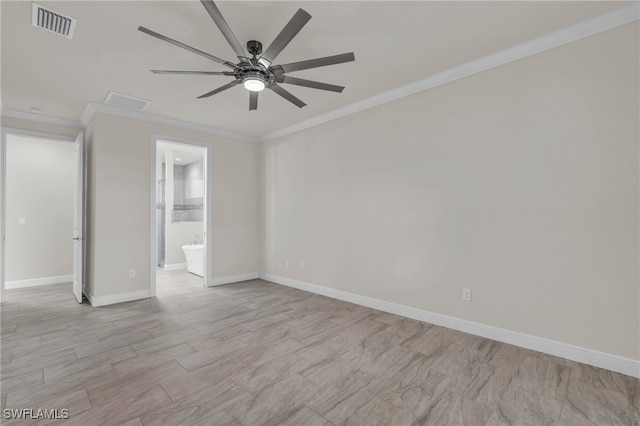 spare room featuring ornamental molding and ceiling fan