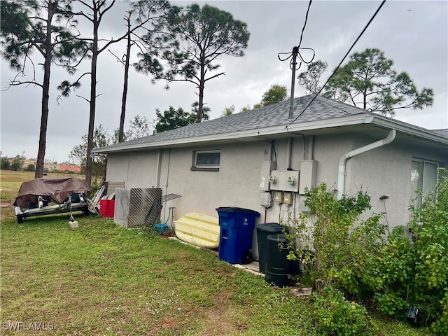 view of property exterior with a yard