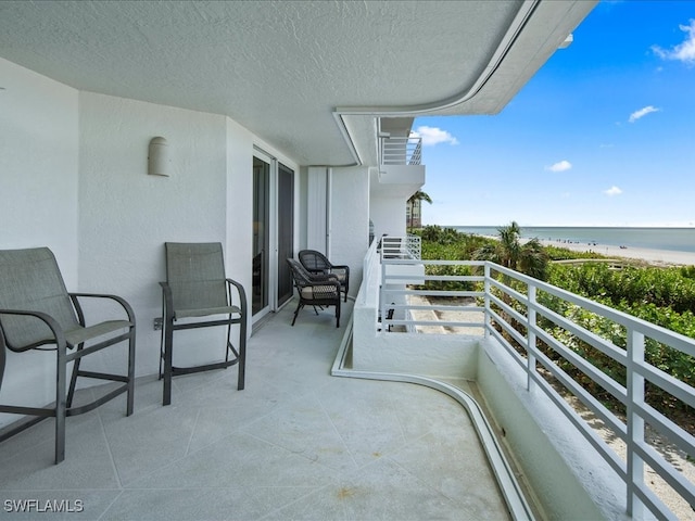 balcony featuring a water view