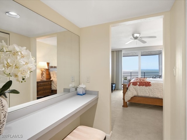 bedroom featuring ceiling fan and light colored carpet