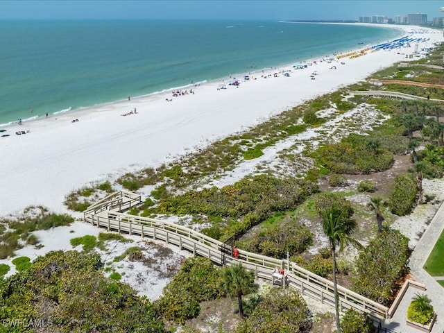 bird's eye view featuring a beach view and a water view