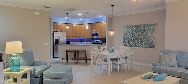 dining space featuring crown molding