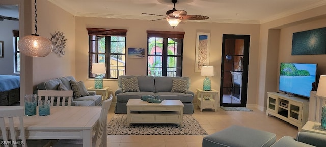 living room with light tile patterned floors, crown molding, and ceiling fan