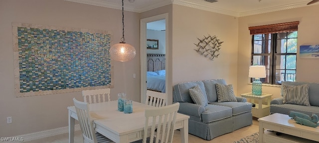 dining space featuring ornamental molding