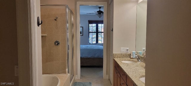 bathroom with tile patterned flooring, shower with separate bathtub, vanity, and ceiling fan