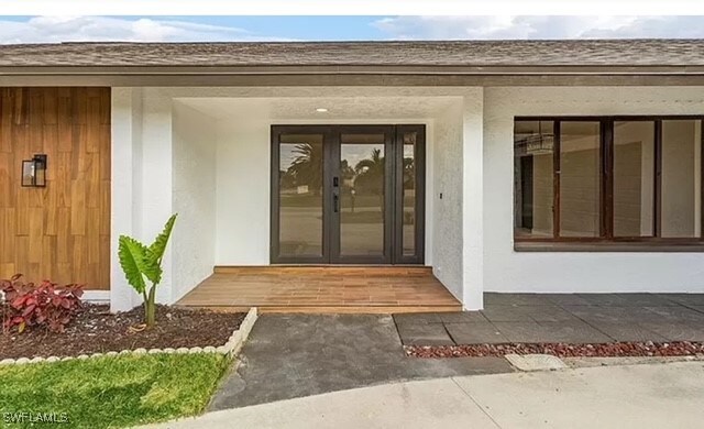 doorway to property featuring french doors