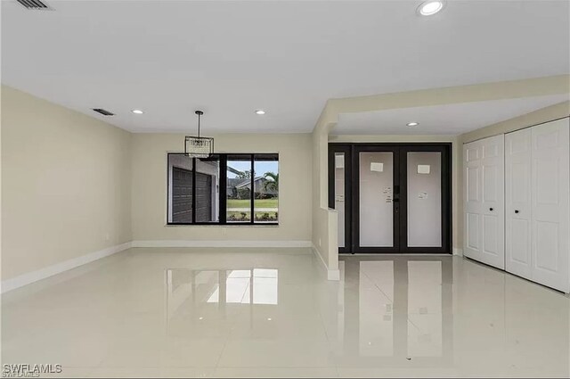 entrance foyer with light tile patterned floors