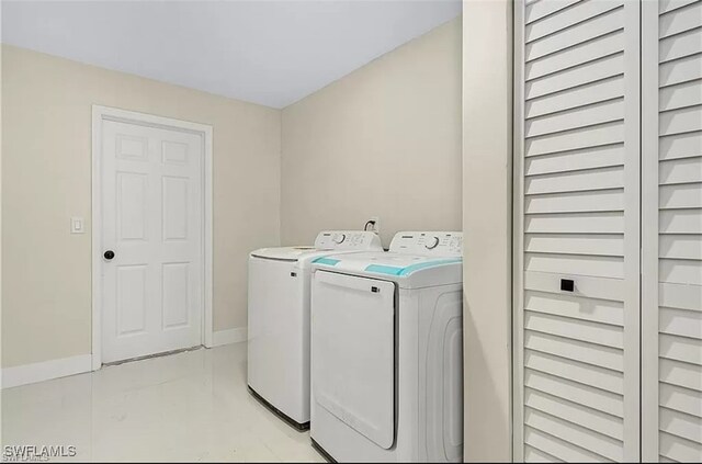 washroom with washer and clothes dryer