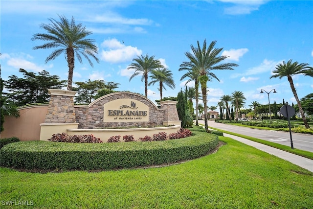 community sign with a lawn