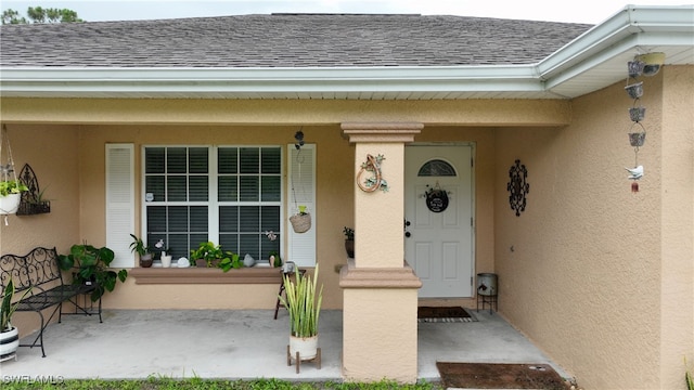 doorway to property with covered porch