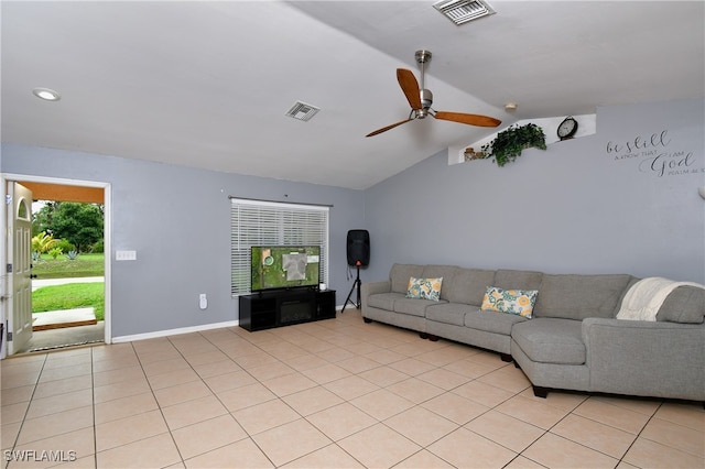 unfurnished living room featuring ceiling fan, lofted ceiling, and light tile patterned floors