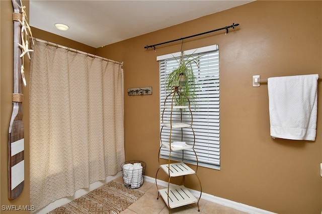 bathroom with tile patterned floors and a shower with curtain