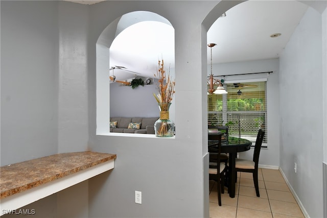 dining space with light tile patterned floors