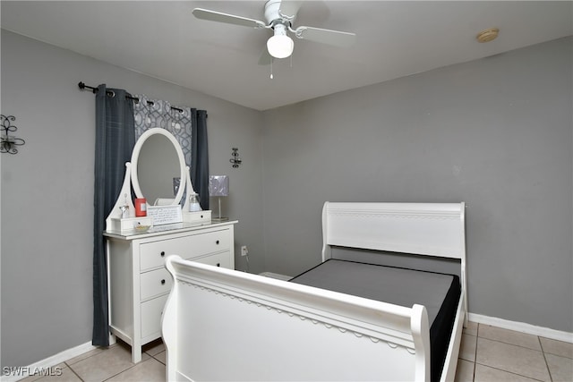 bedroom featuring light tile patterned floors and ceiling fan