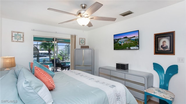 bedroom with ceiling fan and access to outside