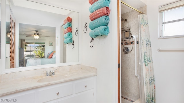 bathroom featuring walk in shower, vanity, plenty of natural light, and ceiling fan