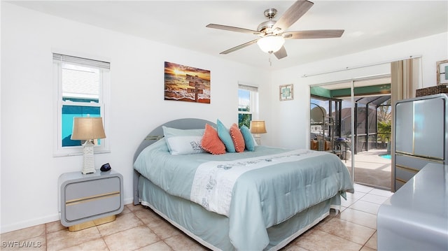 tiled bedroom with access to outside and ceiling fan