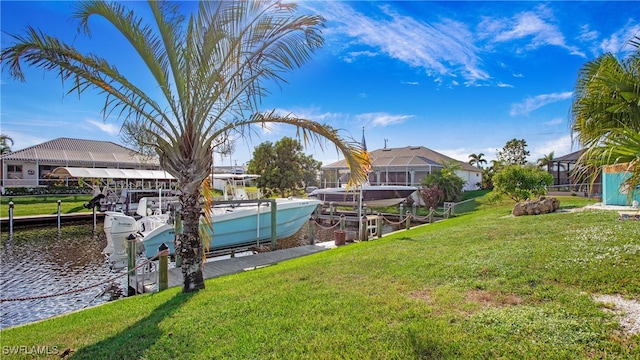 view of yard featuring a boat dock and a water view