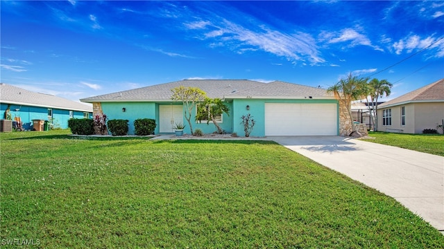 ranch-style house featuring a front lawn and a garage