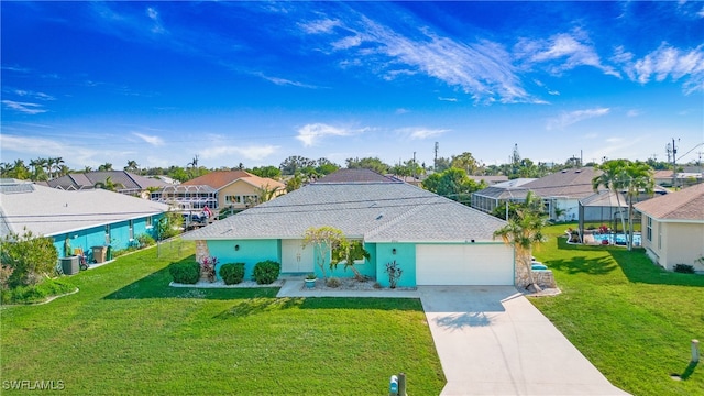 view of front of home featuring a front lawn and a garage