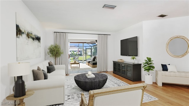 living room with light hardwood / wood-style flooring