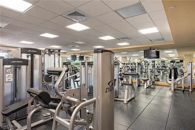 workout area featuring a paneled ceiling