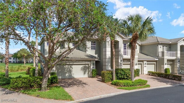 townhome / multi-family property featuring a garage