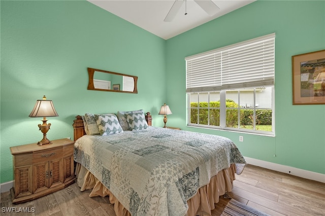 bedroom featuring light hardwood / wood-style floors and ceiling fan