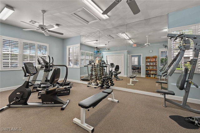 workout area with plenty of natural light and ceiling fan