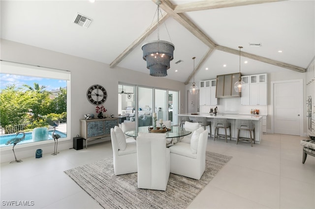 dining room featuring beamed ceiling, a notable chandelier, light tile patterned floors, and high vaulted ceiling