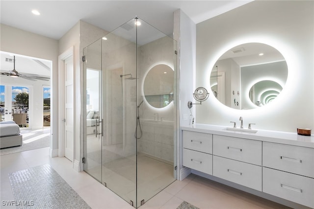 bathroom with ceiling fan, tile patterned flooring, vanity, and an enclosed shower