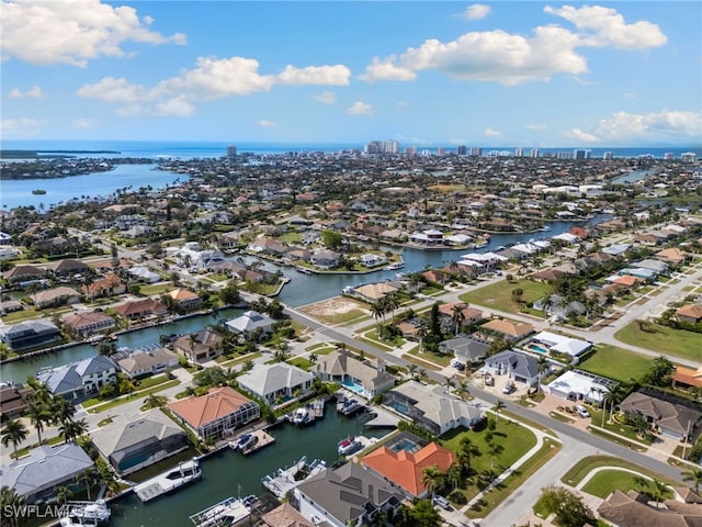 drone / aerial view with a water view