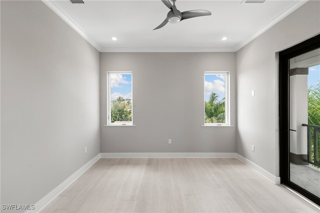 spare room with ceiling fan, a healthy amount of sunlight, and light wood-type flooring