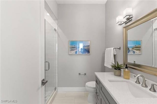 bathroom with toilet, a shower with shower door, vanity, and tile patterned floors