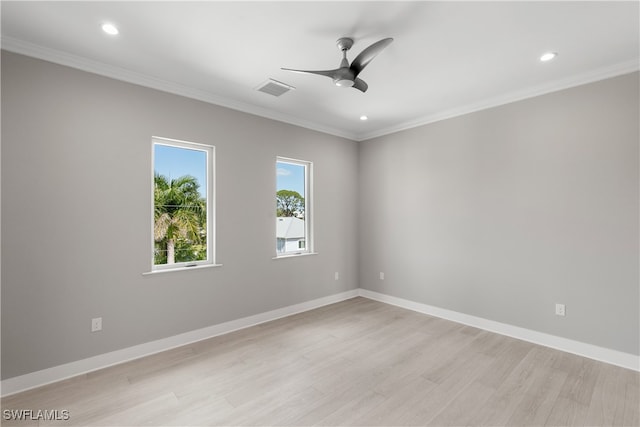 empty room with crown molding, light hardwood / wood-style flooring, and ceiling fan