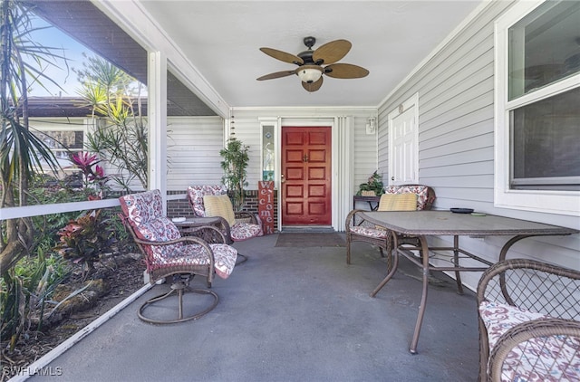 sunroom featuring ceiling fan