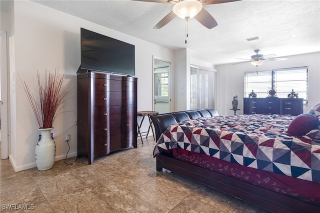 bedroom featuring a textured ceiling and ceiling fan