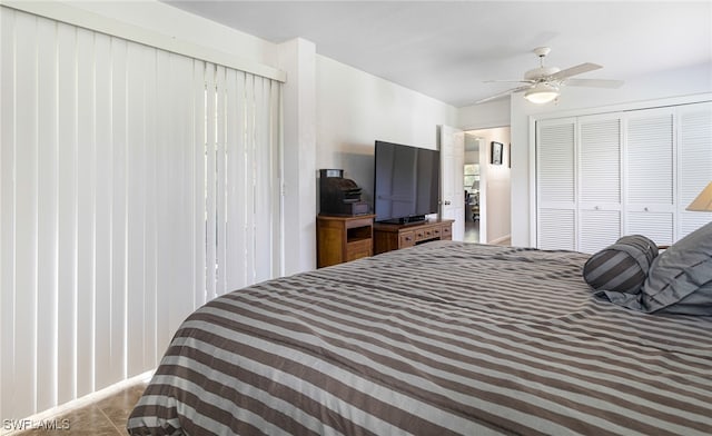 bedroom with ceiling fan and a closet