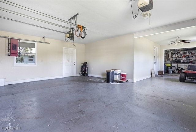 garage featuring ceiling fan and a garage door opener