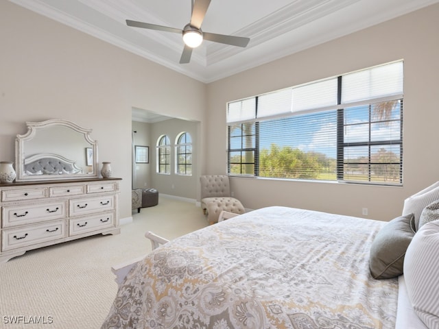 bedroom with ceiling fan, crown molding, and light carpet