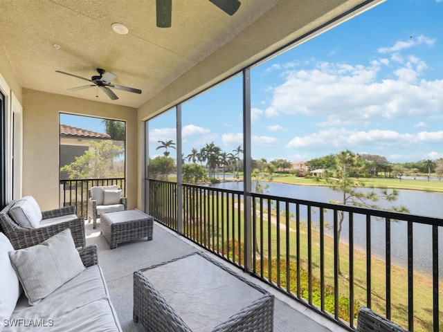 sunroom / solarium with a water view