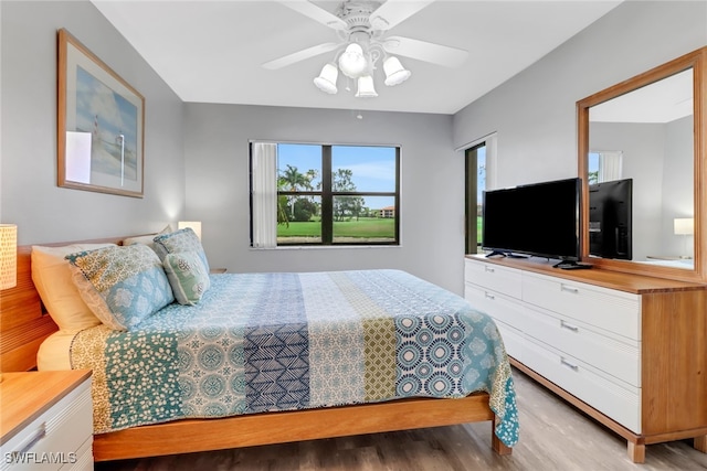 bedroom with light wood-type flooring and ceiling fan