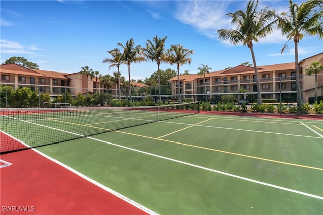 view of tennis court with basketball hoop