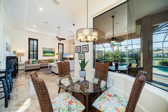 dining space with ornamental molding