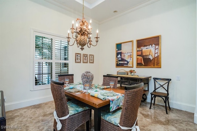 dining area with ornamental molding and an inviting chandelier