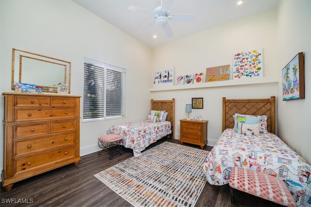 bedroom with dark hardwood / wood-style floors and ceiling fan